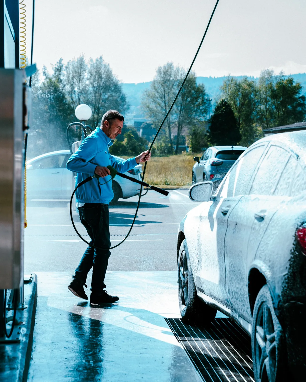 Lavage haute pression d'un véhicule
